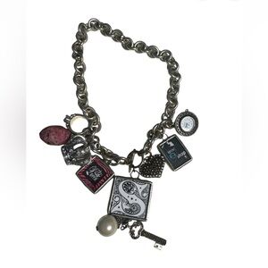 Vintage charm bracelet. Great condition for vintage has a trendz watch charm